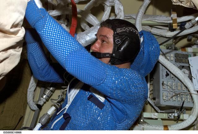 NASA image: Korzun attired in his LCVG prepares for an EVA in the Pirs Docking Compartment
