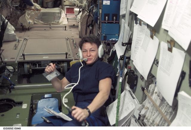 NASA image: Whitson wearing headphones in the SM during Expedition Five on the ISS