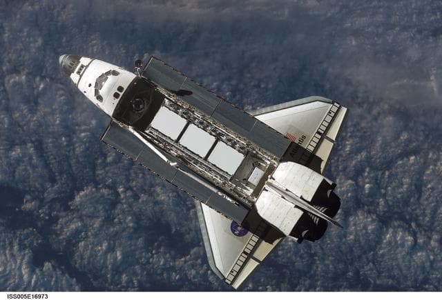 NASA image: Atlantis during STS-112 approach to ISS during Expedition Five