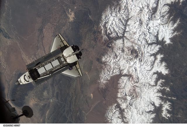 NASA image: Atlantis during STS-112 approach to ISS during Expedition Five