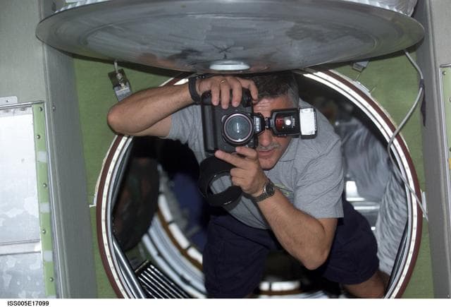 NASA image: Yurchikhin uses a still photo camera while floating in the SM during Expedition Five on the ISS