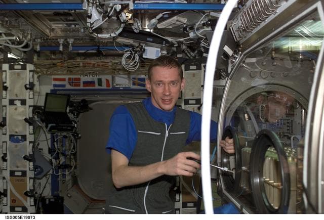 NASA image: DeWinne of ESA works with experiments housed in the MSG in the U.S. Laboratory