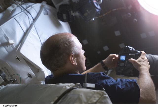 NASA image: Bowersox takes pictures of Earth from the window in Destiny during Expedition Six