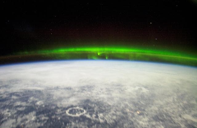NASA image: Crew Earth Observations (CEO) of the Aurora Borealis and city lights taken during Expedition Six