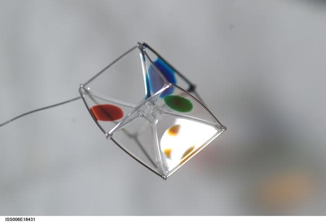 NASA image: Surface Tension Demonstration using Water and Food Coloring in the U.S. Laboratory