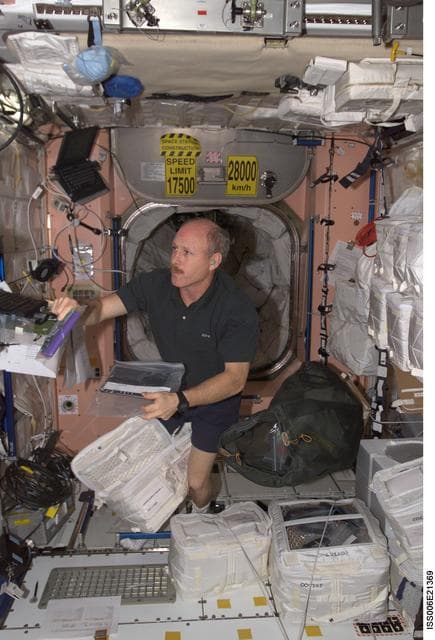 NASA image: Bowersox works at a laptop computer in Node 1 during Expedition Six