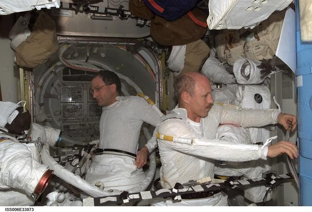 NASA image: Bowersox and Pettit are preparing for an EVA DTO in the Quest Airlock during Expedition Six