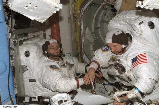 NASA image: Bowersox and Pettit participate in a scheduled EVA DTO in the Quest Airlock during Expedition Six