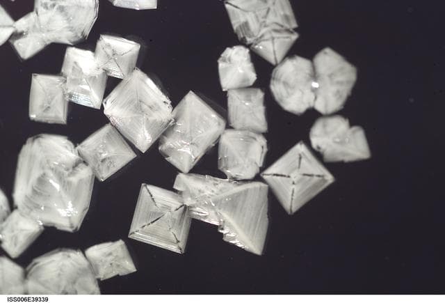 NASA image: View of salt crystals inserted within a 50mm metal loop in the U.S. Laboratory