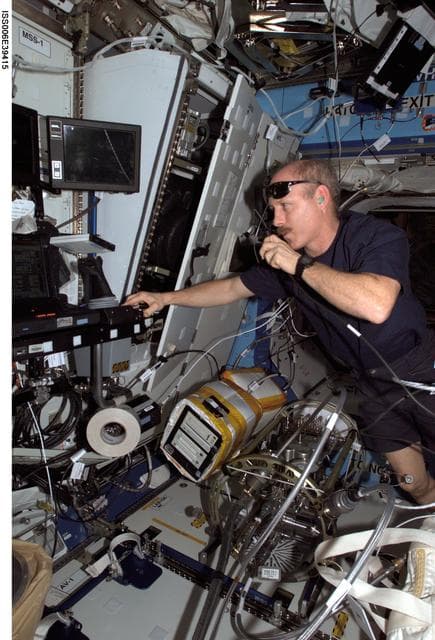 NASA image: Commander Kenneth D. Bowersox working at the AV-1 Rack in the U.S. Laboratory/Destiny