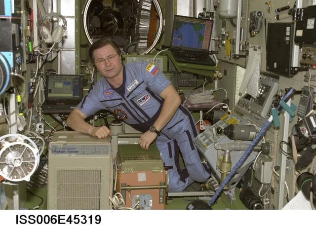 NASA image: Flight Engineer Nikolai Budarin is posing for image near Potok 150MK air decontamination equipment