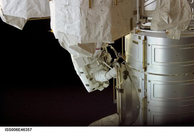 NASA image: View of Commander Kenneth D. Bowersox outside the Airlock performing a variety of tasks