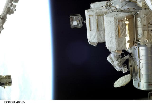 NASA image: View of Flight Engineer Donald R. Pettit emerging from the Quest/Airlock to perform tasks