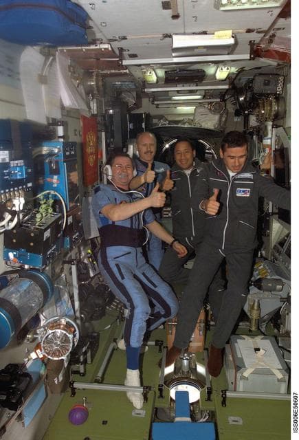 NASA image: Expedition Seven crewmembers pose with two of the Expedition Six crewmembers in the SM