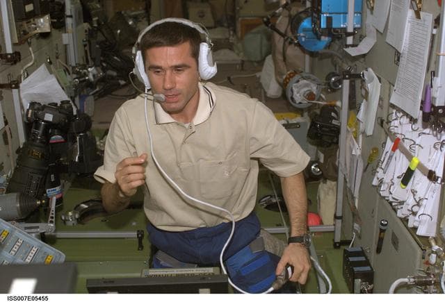 NASA image: Expedition Seven CDR Malenchenko uses radio in Zvezda Service module