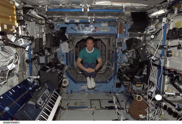 NASA image: Expedition Seven Science Officer Ed Lu tumbles through the Destiny laboratory