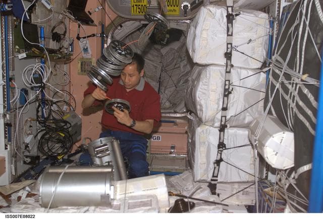 NASA image: Expedition Seven Science Officer Lu works with IRED hardware in Node 1/Unity