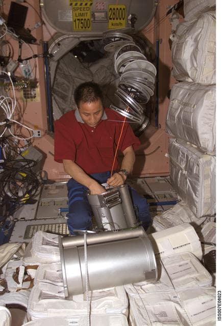 NASA image: Expedition Seven Science Officer Lu works with IRED hardware in Node 1/Unity