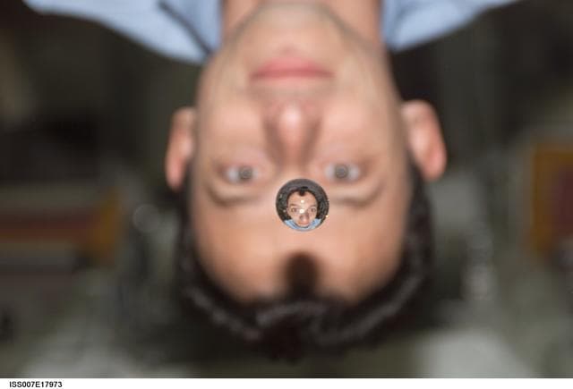 NASA image: Duque plays with a droplet of liquid