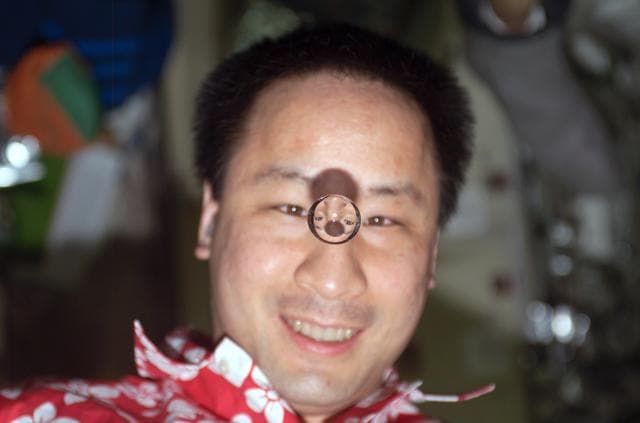 NASA image: Lu plays with a droplet of liquid