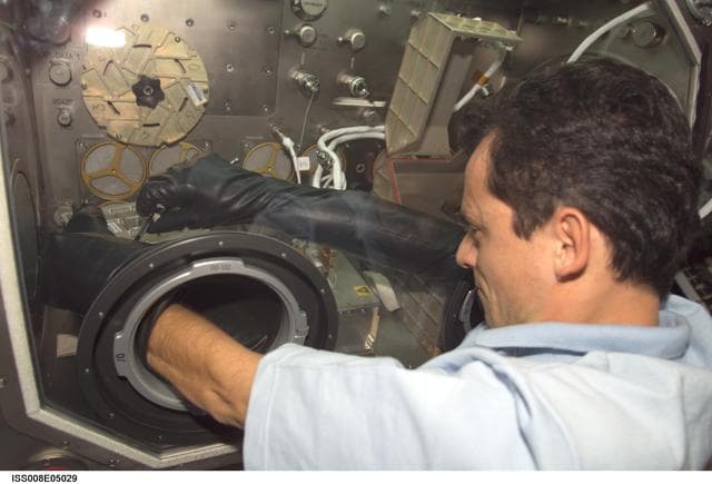 NASA image: Duque works at the MSG for PromISS 2  in the Lab during Expedition Seven / 8 OPS