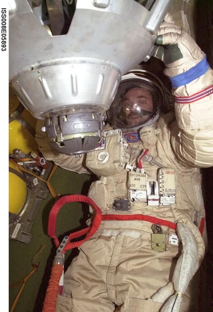 NASA image: Kaleri during Orlan suit-up dry run in the Soyuz TM-3 during Expedition 8