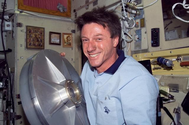 NASA image: Foale holds the top endcap for the TVIS Gyroscope in SM during Expedition 8
