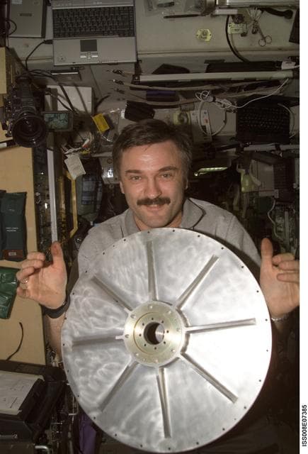 NASA image: Kaleri holds the top endcap for the TVIS Gyroscope in SM during Expedition 8