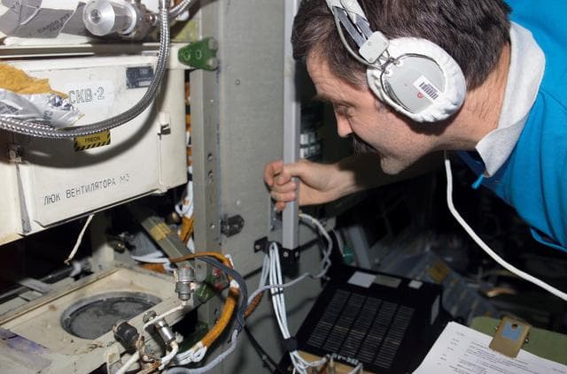 NASA image: Kaleri works on the SKV-2 AC in the SM during Expedition 8