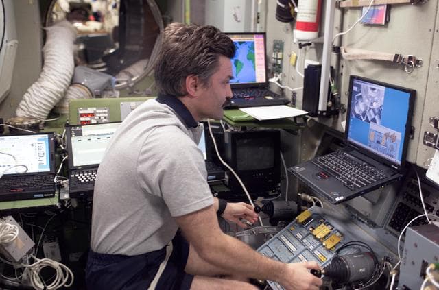 NASA image: Kaleri works with the TORU teleoperated control system in the SM during Expedition 8
