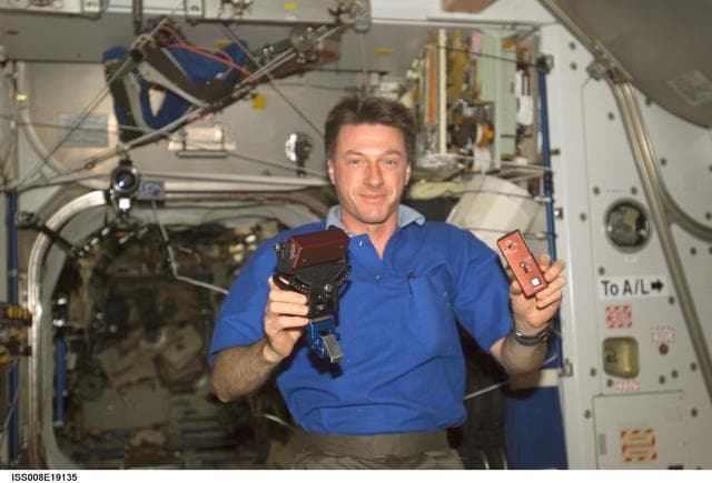 NASA image: Foale works with the SPHERES Beacon / Beacon Tester in Node 1 during Expedition 8