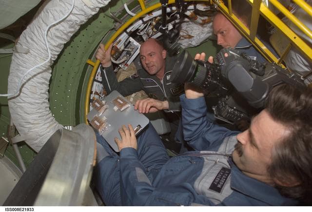 NASA image: Expedition 9 crew greeted by Expedition 8 crew upon arrival to ISS