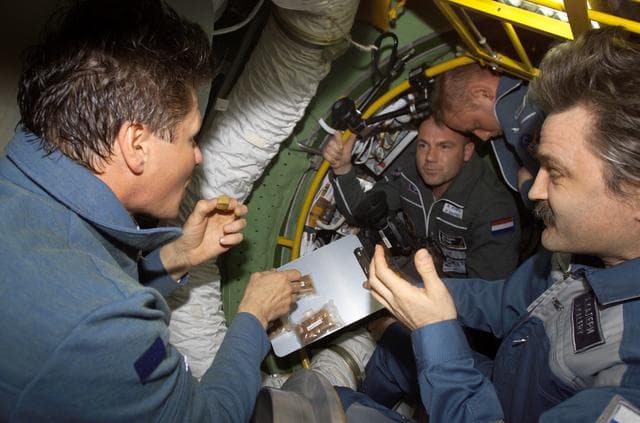 NASA image: Expedition 9 crew greeted by Expedition 8 crew upon arrival to ISS