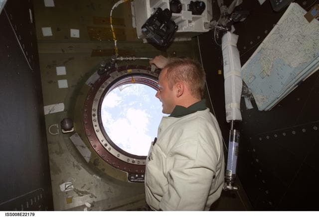 NASA image: Fincke peers through the photo window in U.S. Lab during EXP 8 / EXP 9