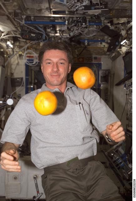 NASA image: Foale juggles citrus fruit in the U.S. Lab during Expedition 8
