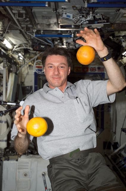 NASA image: Foale juggles citrus fruit in the U.S. Lab during Expedition 8