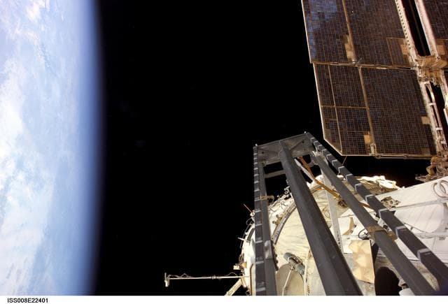 NASA image: Pirs PWS, Zvezda SM and Earth's limb as seen during Expedition 8 EVA 1 operations