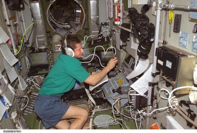 NASA image: Padalka conducts a test of the TORU Teleoperator Control System in the SM during Expedition 9