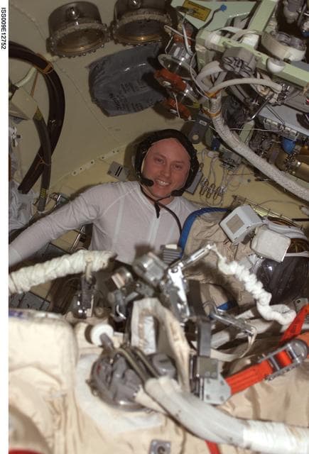 NASA image: Fincke conducts final COM checks on his Orlan suit before an EVA during Expedition 9