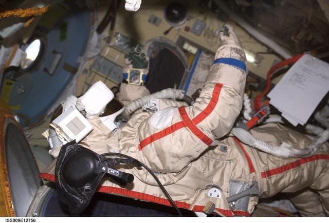 NASA image: A Russian Orlan suit floats in the DC during suit checkout OPS before an EVA during Expedition 9