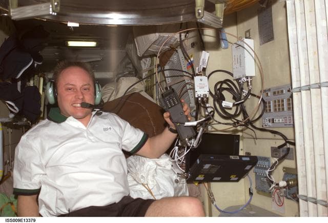 NASA image: Fincke talks on the ISS Ham radio in the FGB during Expedition 9