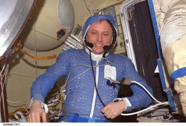 NASA image: Fincke wears the LCVG during Orlan suit checkout in the DC during Expedition 9