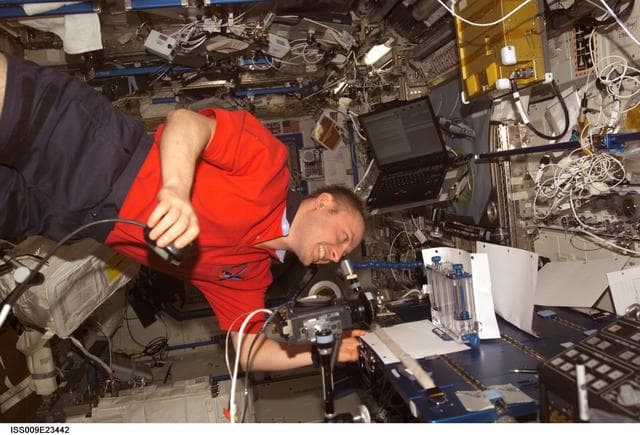 NASA image: Fincke works on the CFE set up on the MWA in the U.S. Lab during Expedition 9