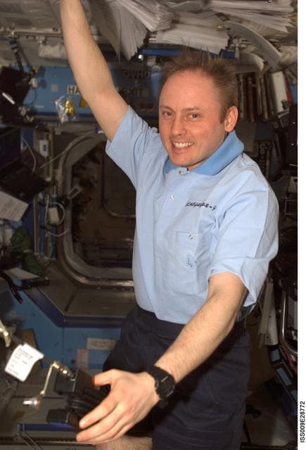 NASA image: Fincke collects air samples in the U.S. Lab using the DST during Expedition 9