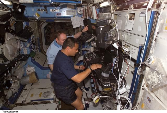 NASA image: Chiao and Fincke work at the SSRMS workstation as they conduct Robotic Handover OPS during Expedition 9/10 joint OPS