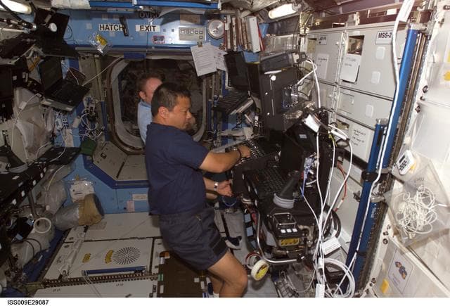 NASA image: Chiao and Fincke work at the SSRMS workstation as they conduct Robotic Handover OPS during Expedition 9/10 joint OPS