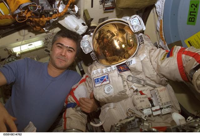 NASA image: Sharipov poses with EMU in the Airlock during Expedition 10