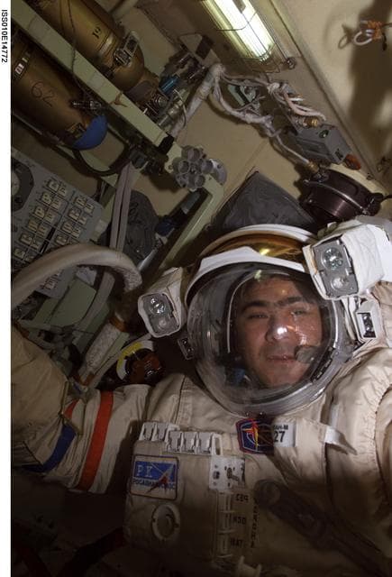 NASA image: Sharipov wearing an EMU in the Airlock during Expedition 10