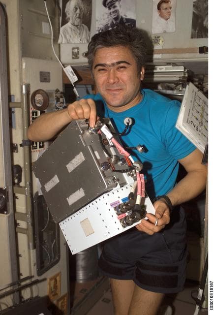 NASA image: Sharipov holds an Electronic Box Assembly from the TVIS in the SM during Expedition 10