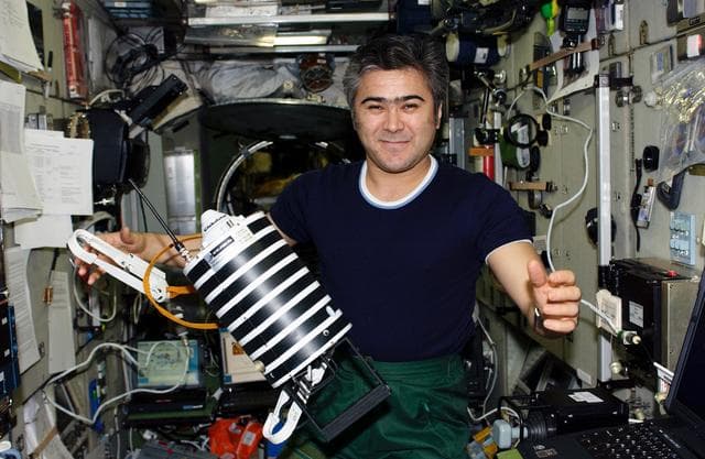 NASA image: Sharipov holds Nanosputnik in the SM during Expedition 10